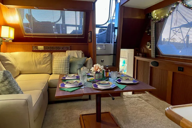  Yacht Photos Pics Interior of 1988 Tollycraft 40 Sundeck Motor Yacht with cozy dining setup.