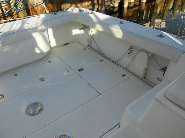 Fish Tales Yacht Photos Pics Spacious deck of 2000 Boston Whaler 34 Defiance boat, featuring storage compartments.