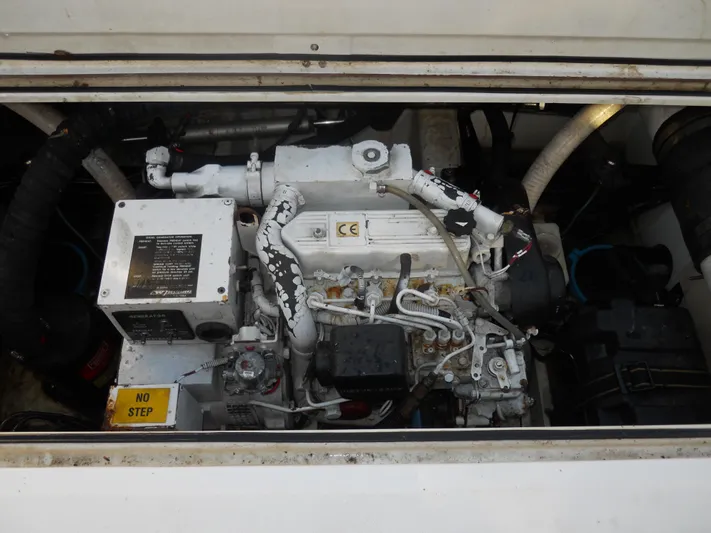 Fish Tales Yacht Photos Pics Engine compartment of a 2000 Boston Whaler 34 Defiance boat.
