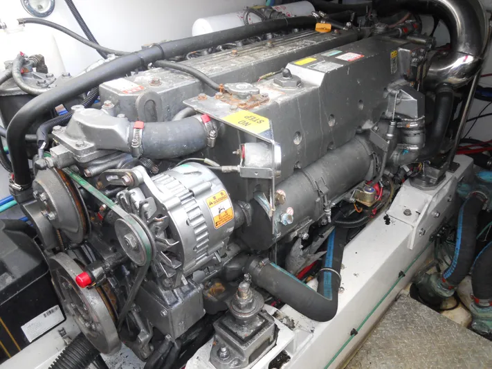 Fish Tales Yacht Photos Pics Engine of a 2000 Boston Whaler 34 Defiance boat, showcasing mechanical components.