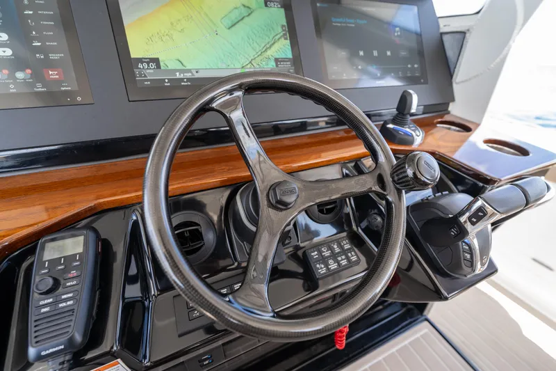 Golden Hour Yacht Photos Pics Steering console of 2021 Everglades 395 Center Console boat with modern controls and displays.
