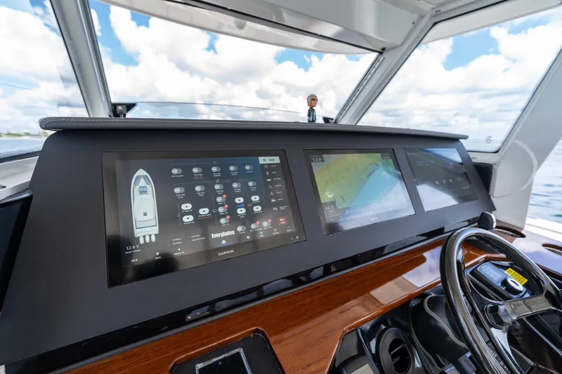 Golden Hour Yacht Photos Pics Dashboard of 2021 Everglades 395 Center Console with advanced navigation displays.