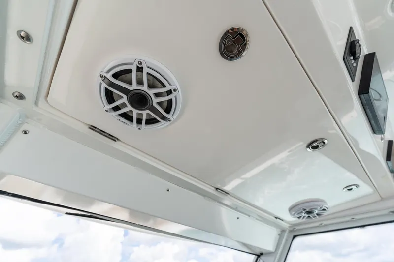 Golden Hour Yacht Photos Pics 2021 Everglades 395 Center Console boat ceiling with speakers and lighting fixtures.