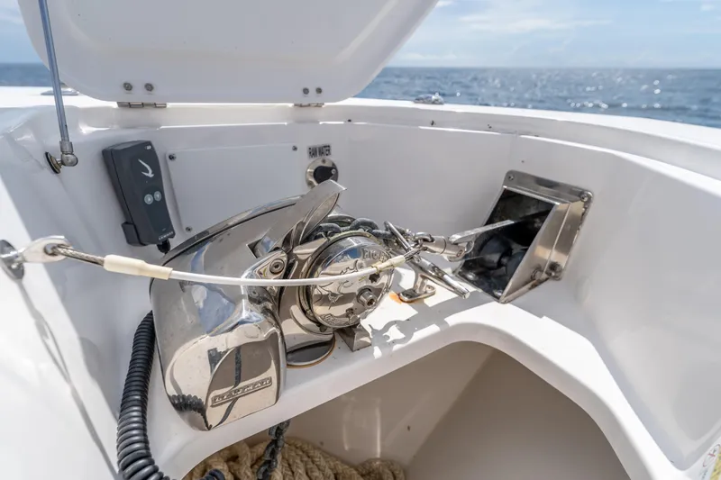 Golden Hour Yacht Photos Pics Anchor system on 2021 Everglades 395 Center Console boat, ocean in background.