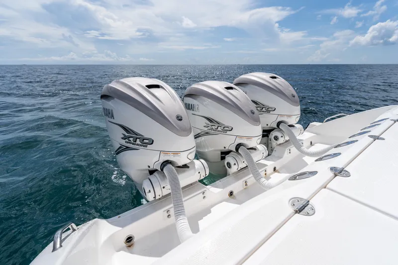 Golden Hour Yacht Photos Pics Triple Yamaha XTO outboard engines on 2021 Everglades 395 Center Console boat.
