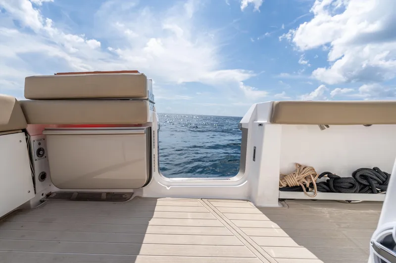 Golden Hour Yacht Photos Pics 2021 Everglades 395 Center Console boat interior with ocean view and clear sky.