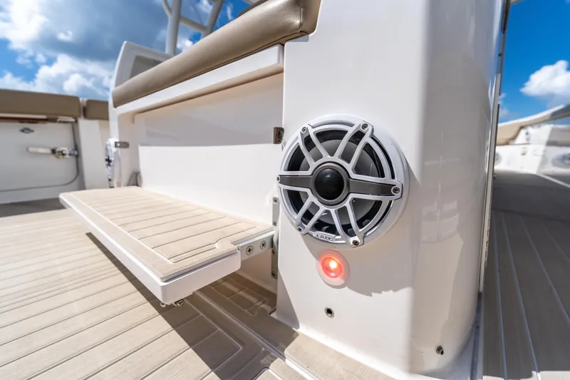 Golden Hour Yacht Photos Pics 2021 Everglades 395 Center Console boat interior with speaker and seating detail.