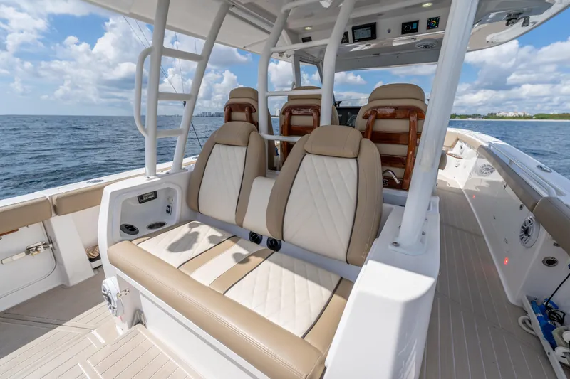 Golden Hour Yacht Photos Pics 2021 Everglades 395 Center Console boat interior with luxurious seating on open water.
