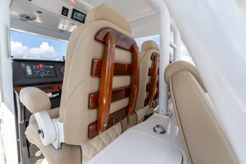 Golden Hour Yacht Photos Pics Luxurious seating on 2021 Everglades 395 Center Console boat interior, featuring elegant design.