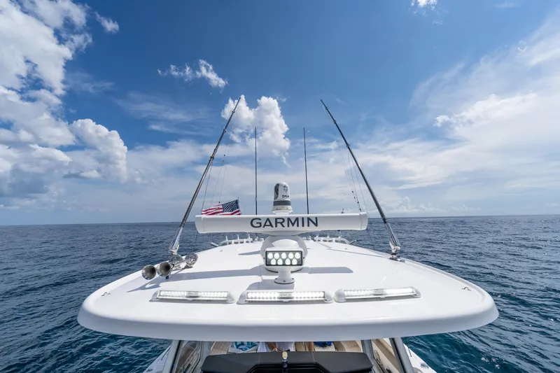 Golden Hour Yacht Photos Pics Everglades 395 Center Console 2021 boat on open sea under clear blue sky.