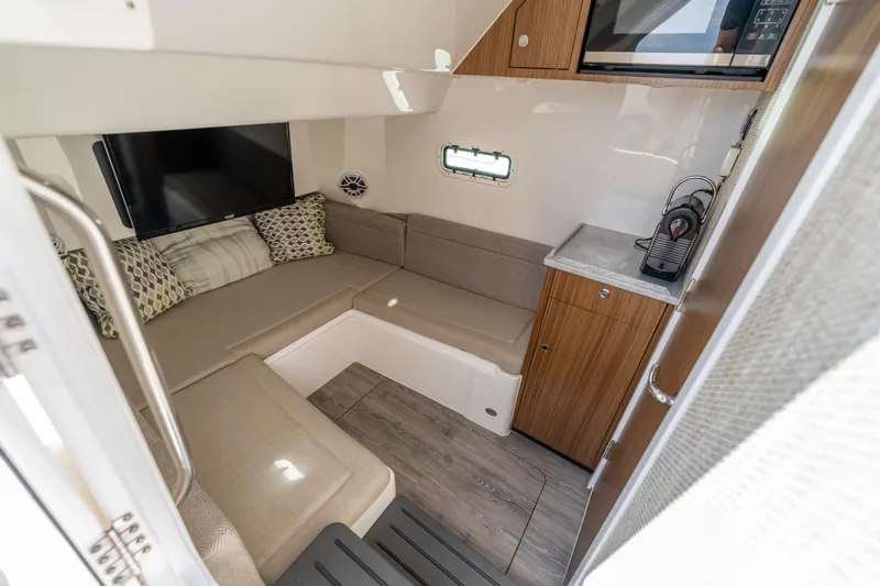 Golden Hour Yacht Photos Pics Interior of 2021 Everglades 395 Center Console, featuring cozy seating and modern amenities.