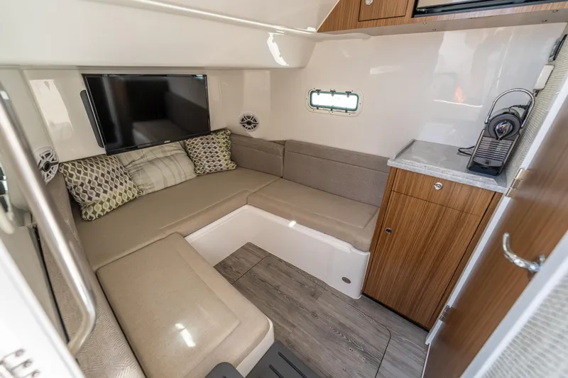 Golden Hour Yacht Photos Pics Interior of 2021 Everglades 395 Center Console with cozy seating and modern amenities.