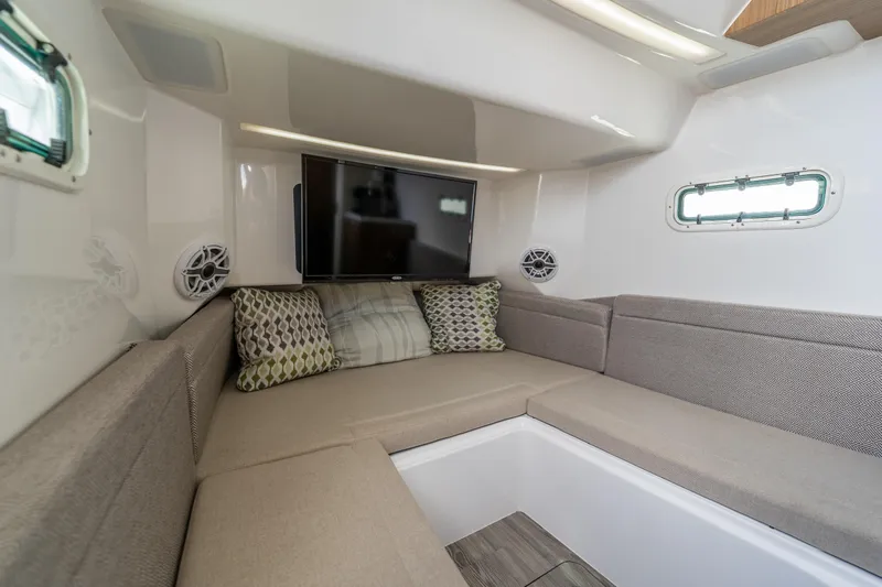 Golden Hour Yacht Photos Pics Interior of 2021 Everglades 395 Center Console with cozy seating and TV.