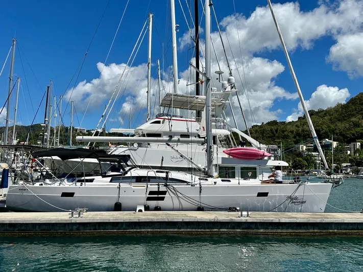 Mystic Impression Yacht Photos Pics 2022 Elan Impression 50.1 yacht docked at marina under clear blue sky.