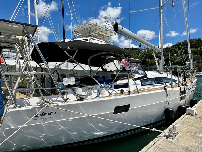 Mystic Impression Yacht Photos Pics 2022 Elan Impression 50.1 yacht docked at marina under blue sky.