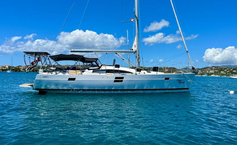 Mystic Impression Yacht Photos Pics 2022 Elan Impression 50.1 sailboat on clear blue water under a sunny sky.