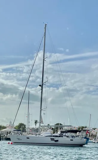 Mystic Impression Yacht Photos Pics 2022 Elan Impression 50.1 sailboat on calm water under a clear sky.