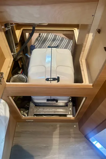 Mystic Impression Yacht Photos Pics Elan Impression 50.1 2022 yacht interior showing storage compartment with equipment.