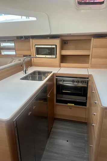 Mystic Impression Yacht Photos Pics Modern kitchen interior of 2022 Elan Impression 50.1 yacht with sleek appliances.