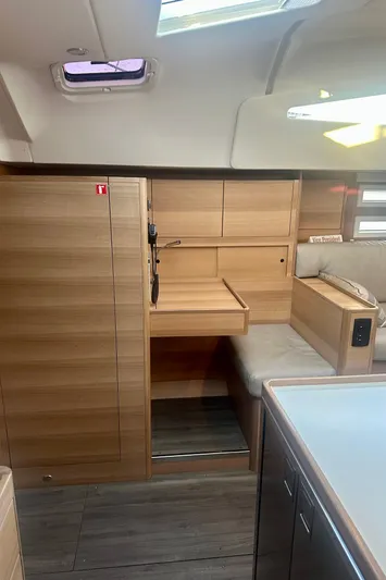 Mystic Impression Yacht Photos Pics 2022 Elan Impression 50.1 yacht interior with modern wood finish and seating area.