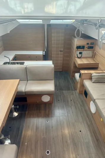 Mystic Impression Yacht Photos Pics Interior of 2022 Elan Impression 50.1 yacht, featuring modern seating and wooden finishes.