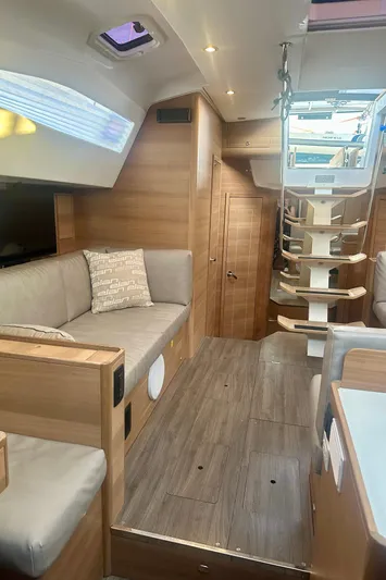 Mystic Impression Yacht Photos Pics Interior of 2022 Elan Impression 50.1 yacht, featuring modern wood finishes and comfortable seating.