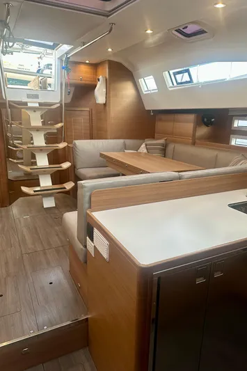 Mystic Impression Yacht Photos Pics 2022 Elan Impression 50.1 yacht interior with modern seating and wooden finishes.