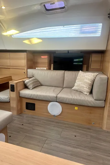 Mystic Impression Yacht Photos Pics 2022 Elan Impression 50.1 yacht interior with modern seating and wooden accents.