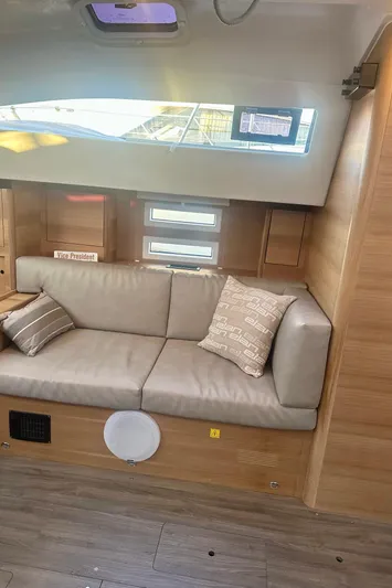 Mystic Impression Yacht Photos Pics Interior of 2022 Elan Impression 50.1 yacht with modern seating and wooden accents.
