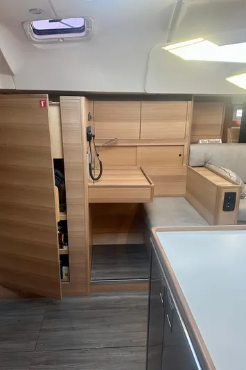 Mystic Impression Yacht Photos Pics Modern interior of 2022 Elan Impression 50.1 yacht with sleek wooden cabinetry.