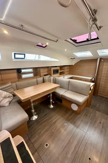 Mystic Impression Yacht Photos Pics 2022 Elan Impression 50.1 yacht interior with modern seating and dining area.