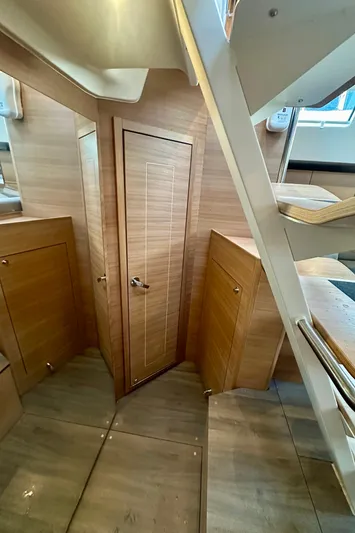 Mystic Impression Yacht Photos Pics 2022 Elan Impression 50.1 yacht interior with wooden finishes and staircase.