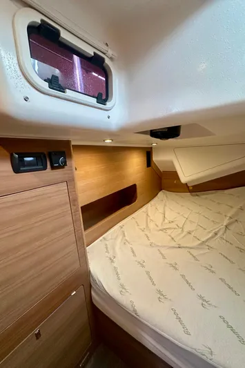 Mystic Impression Yacht Photos Pics 2022 Elan Impression 50.1 yacht cabin with wooden interior and cozy bed.
