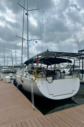 Mystic Impression Yacht Photos Pics 2022 Elan Impression 50.1 yacht docked at marina under cloudy sky.