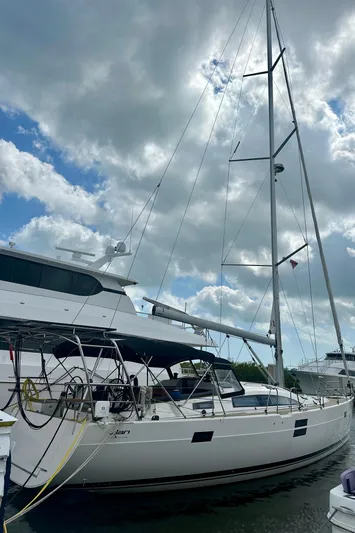 Mystic Impression Yacht Photos Pics 2022 Elan Impression 50.1 sailboat docked under cloudy sky.