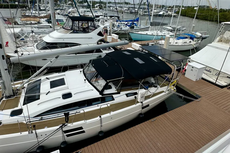 Mystic Impression Yacht Photos Pics 2022 Elan Impression 50.1 yacht docked at marina with other boats.