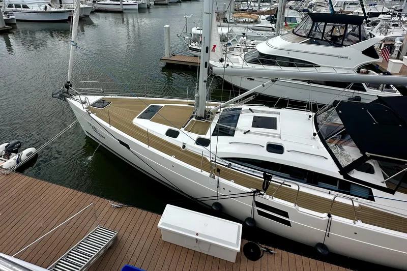 Mystic Impression Yacht Photos Pics 2022 Elan Impression 50.1 yacht docked at marina, surrounded by other boats.