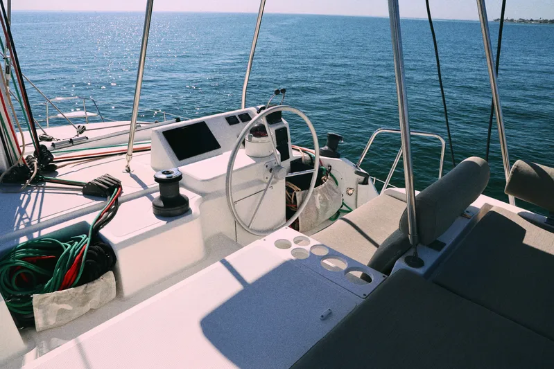 Wiley Pixie Yacht Photos Pics 2023 Bali CATSPACE catamaran helm with ocean view, featuring modern navigation equipment.
