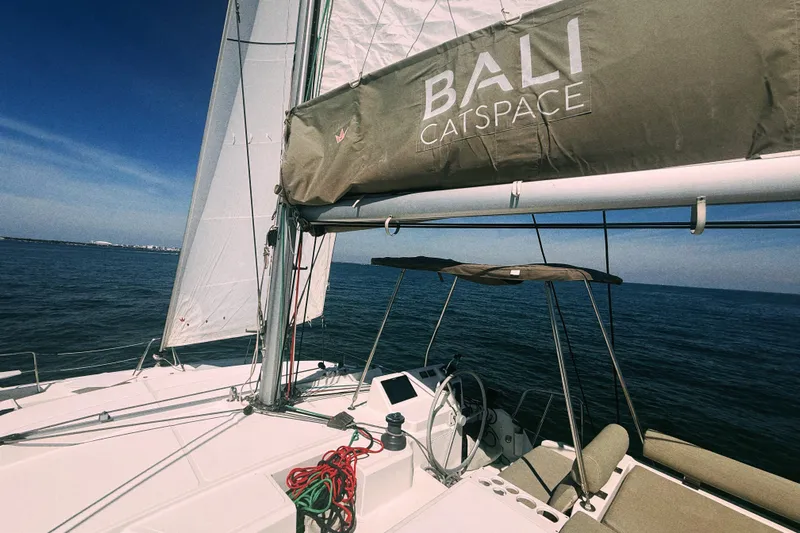 Wiley Pixie Yacht Photos Pics 2023 Bali CATSPACE catamaran sailing on open sea under clear blue sky.