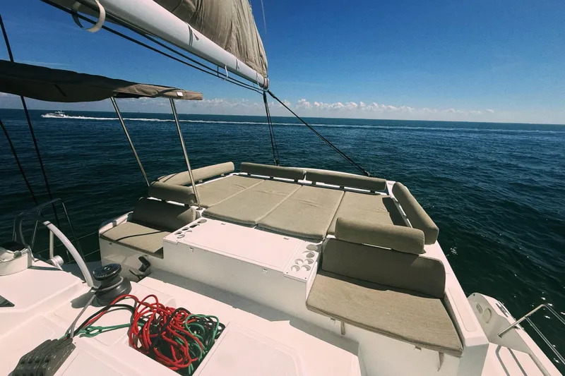 Wiley Pixie Yacht Photos Pics 2023 Bali CATSPACE catamaran sailing on open sea under clear blue sky.