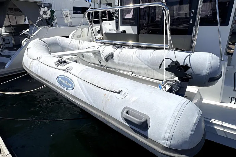 Wiley Pixie Yacht Photos Pics Inflatable boat on 2023 Bali CATSPACE catamaran, docked at marina.