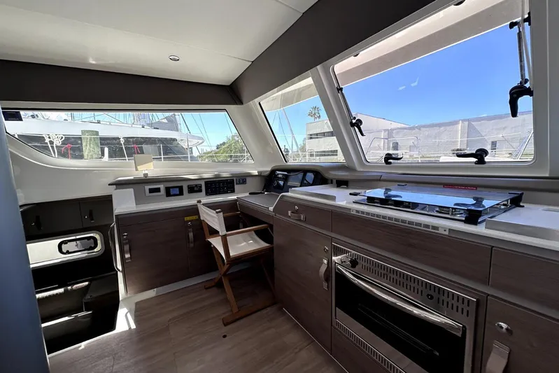 Wiley Pixie Yacht Photos Pics Interior of 2023 Bali CATSPACE yacht with modern kitchen and large windows.