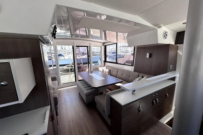 Wiley Pixie Yacht Photos Pics 2023 Bali CATSPACE yacht interior with modern seating and large windows.