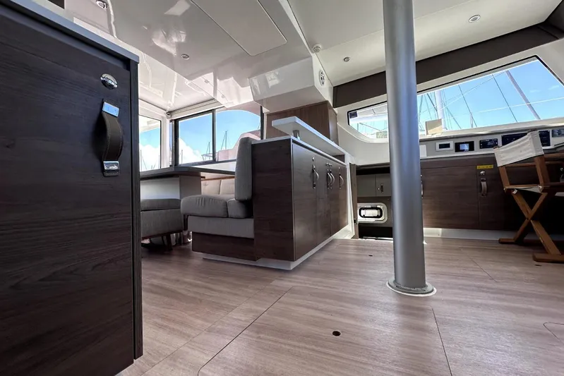 Wiley Pixie Yacht Photos Pics Interior of 2023 Bali CATSPACE catamaran, featuring modern wood finishes and spacious seating area.