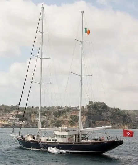 42 M Custom Made Motorsailor Yacht Photos Pics Custom Made 42 M Motorsailor, 2006, sailing near rocky coastline under cloudy sky.