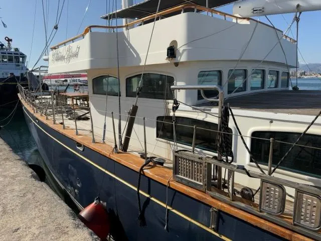 42 M Custom Made Motorsailor Yacht Photos Pics Custom Made 42 M Motorsailor, 2006, docked at a marina, showcasing elegant design and craftsmanship.