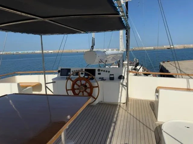 42 M Custom Made Motorsailor Yacht Photos Pics Custom Made 42 M Motorsailor, 2006, featuring a spacious deck and helm, docked by the sea.