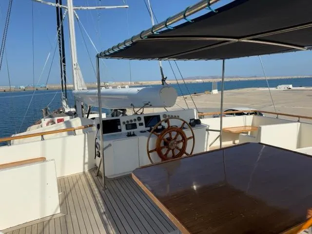 42 M Custom Made Motorsailor Yacht Photos Pics Custom Made 42 M Motorsailor, 2006, featuring a spacious deck and helm, docked at a marina.