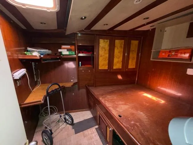 42 M Custom Made Motorsailor Yacht Photos Pics Interior of 2006 Custom Made 42 M Motorsailor with wooden furnishings and storage space.