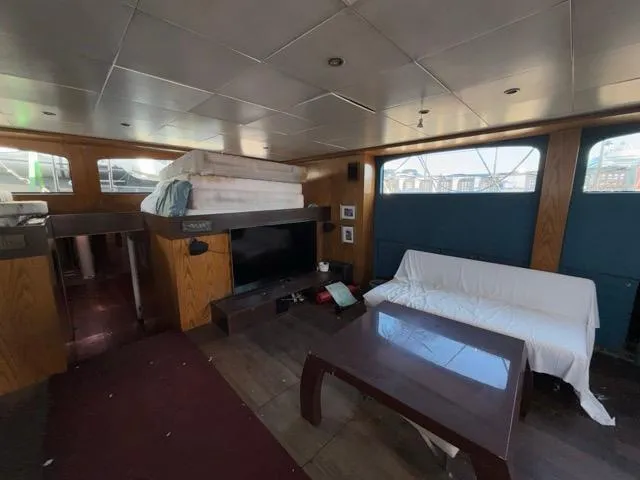 42 M Custom Made Motorsailor Yacht Photos Pics Interior of 2006 Custom Made 42 M Motorsailor with cozy seating and modern decor.